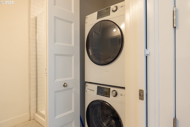 laundry room featuring laundry area and stacked washer / dryer