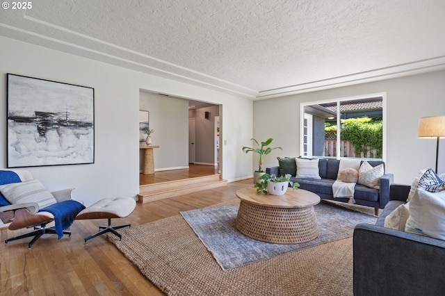 17787 Kelok Rd, Lake Oswego, OR 97034 - living area featuring a textured ceiling, wood finished floors, and baseboards