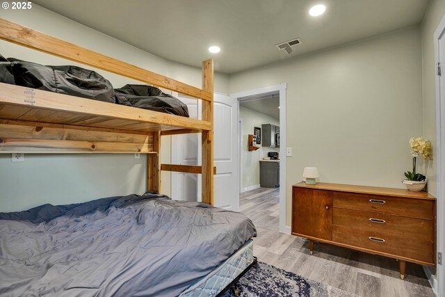 bedroom with light hardwood / wood-style flooring