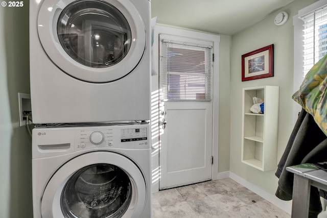 217 N Molalla Ave, Molalla, OR 97038 - washroom featuring stacked washer and clothes dryer and baseboards