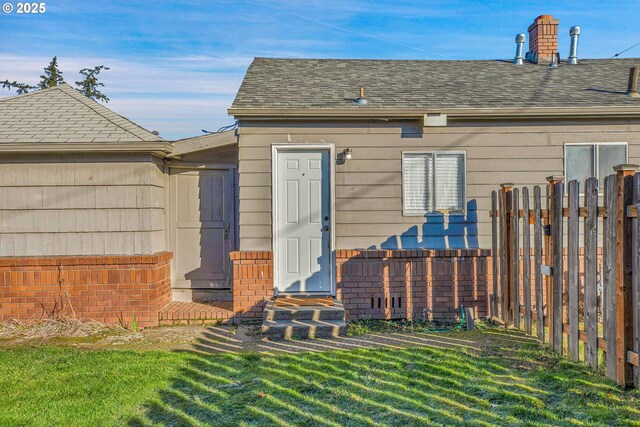 view of outbuilding with a yard