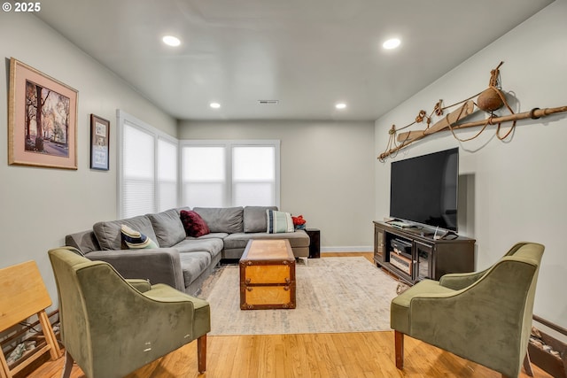 living room with light hardwood / wood-style floors