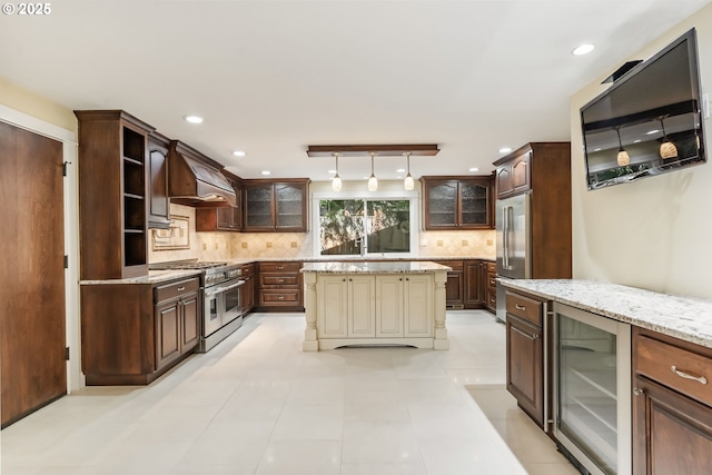 kitchen with glass insert cabinets, beverage cooler, dark brown cabinetry, and high quality appliances