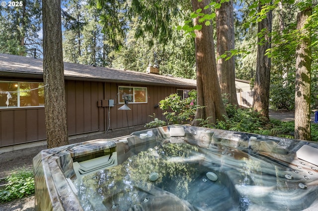 exterior space featuring a hot tub