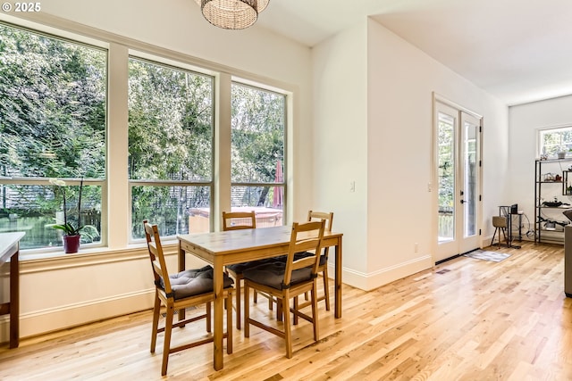 13902 SW Andrew Ter, Portland, OR 97224 - dining room with light wood-style flooring and a chandelier