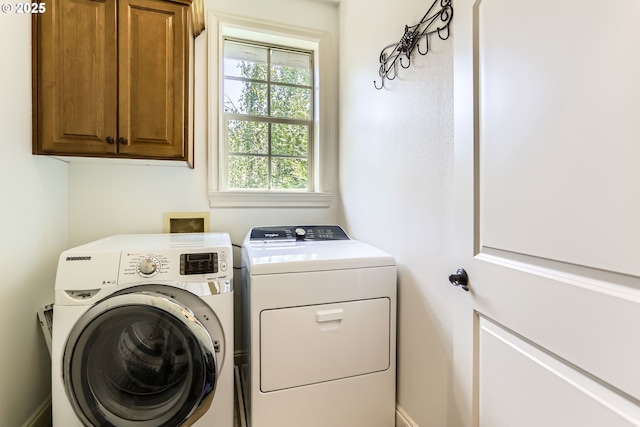 13902 SW Andrew Ter, Portland, OR 97224 - washroom featuring cabinet space and independent washer and dryer
