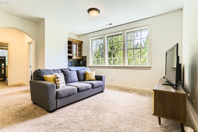 13902 SW Andrew Ter, Portland, OR 97224 - carpeted living area with arched walkways and baseboards