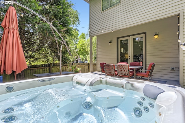 13902 SW Andrew Ter, Portland, OR 97224 - view of patio featuring a hot tub and french doors