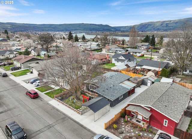 drone / aerial view with a residential view and a mountain view