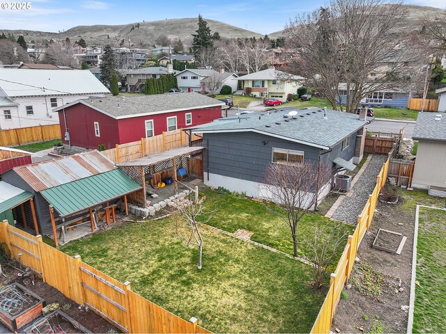 drone / aerial view featuring a mountain view and a residential view