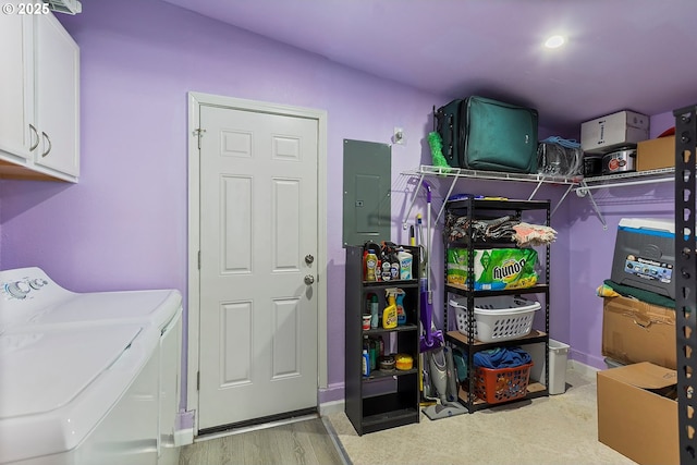 interior space with electric panel and washing machine and dryer