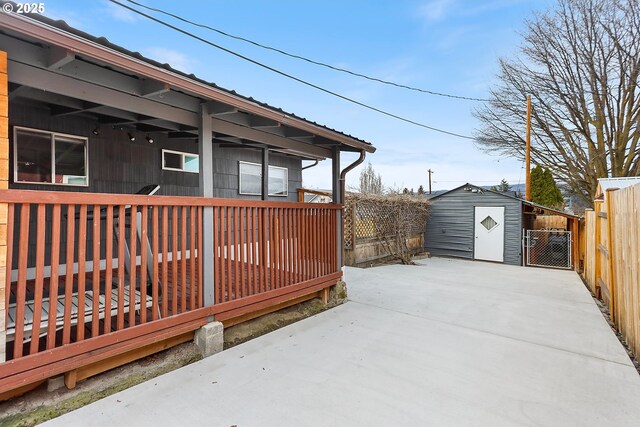 exterior space with a shed, an outdoor structure, and fence