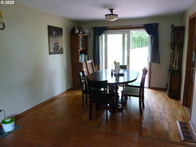 22225 SE Peggy Ann Dr, Damascus, OR 97089 - dining area with light wood-type flooring and baseboards