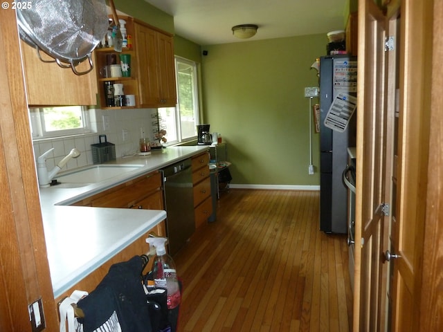 22225 SE Peggy Ann Dr, Damascus, OR 97089 - kitchen with stainless steel dishwasher, a sink, healthy amount of natural light, and brown cabinets