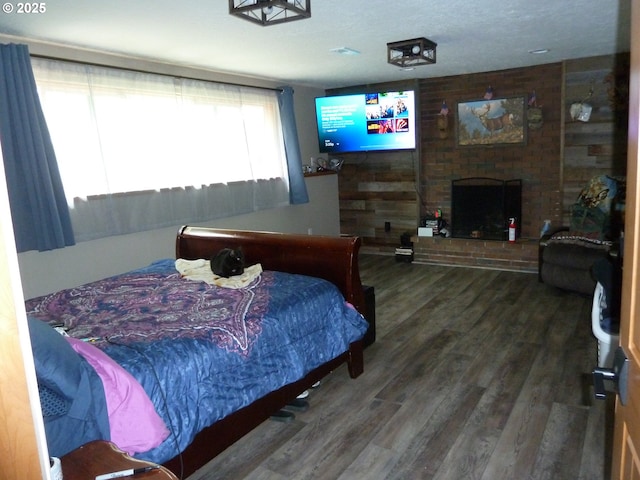 22225 SE Peggy Ann Dr, Damascus, OR 97089 - bedroom with wood finished floors and a brick fireplace