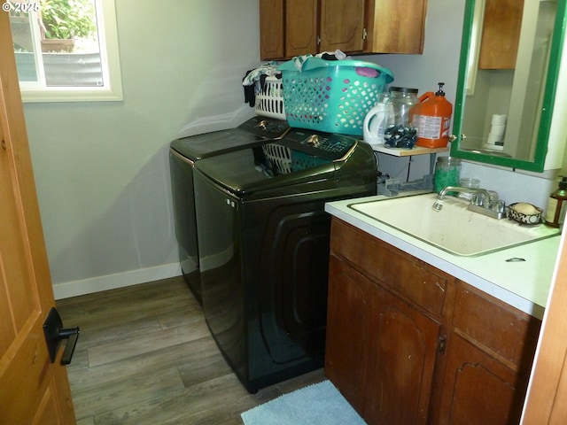 22225 SE Peggy Ann Dr, Damascus, OR 97089 - laundry room featuring washer and dryer, cabinet space, wood finished floors, and baseboards