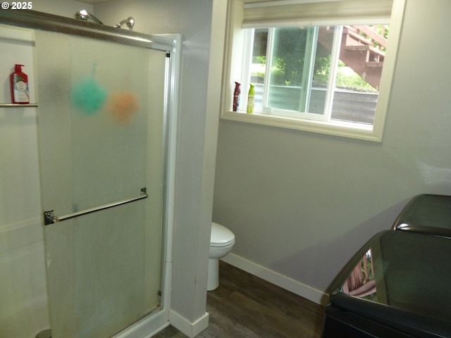 22225 SE Peggy Ann Dr, Damascus, OR 97089 - full bathroom with a stall shower, wood finished floors, toilet, and baseboards