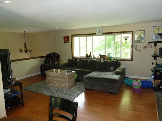 22225 SE Peggy Ann Dr, Damascus, OR 97089 - living area featuring a chandelier, wood finished floors, and baseboards
