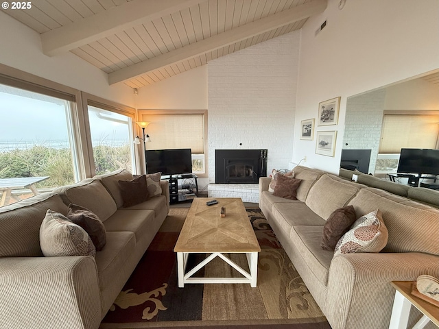 living room with visible vents, a fireplace, wooden ceiling, and beam ceiling