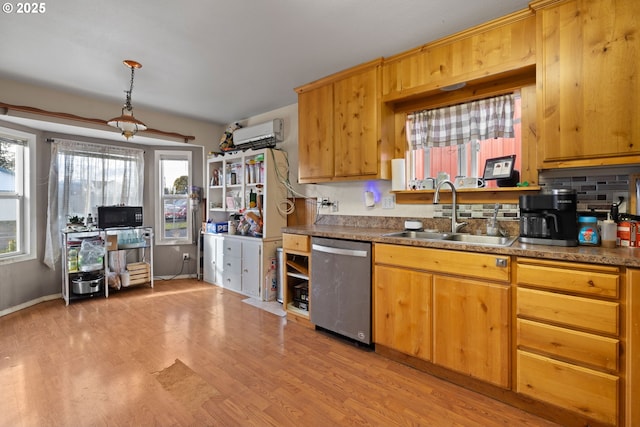 kitchen with decorative light fixtures, dishwasher, sink, backsplash, and light hardwood / wood-style flooring