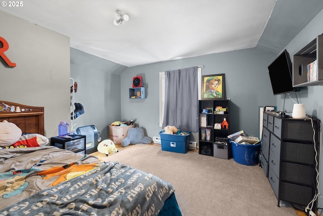 bedroom featuring light colored carpet and vaulted ceiling