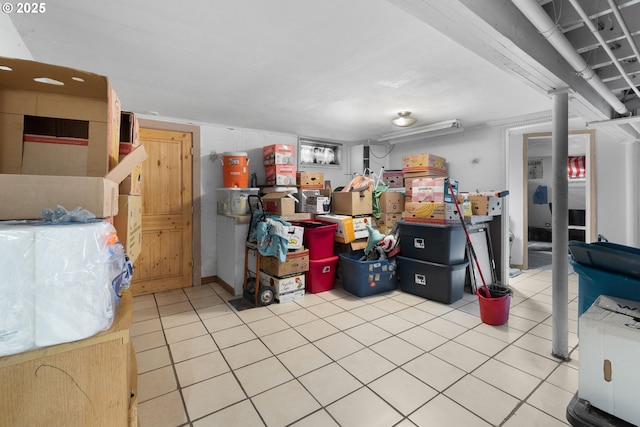 basement with light tile patterned flooring