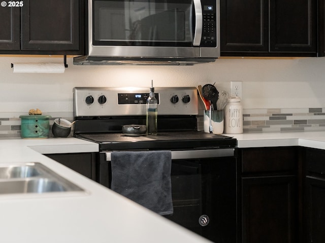 1939 NE 117th Ct, Vancouver, WA 98684 - kitchen featuring appliances with stainless steel finishes, light countertops, and dark cabinets