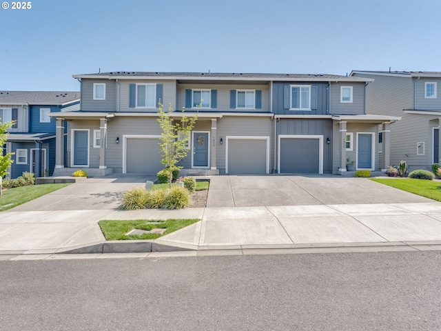 1939 NE 117th Ct, Vancouver, WA 98684 - townhome / multi-family property featuring driveway, board and batten siding, and a garage