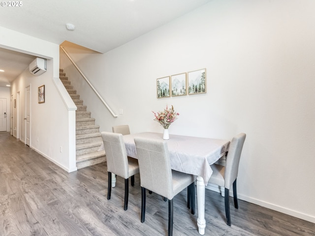1939 NE 117th Ct, Vancouver, WA 98684 - dining room with stairs, a wall unit AC, wood finished floors, and baseboards