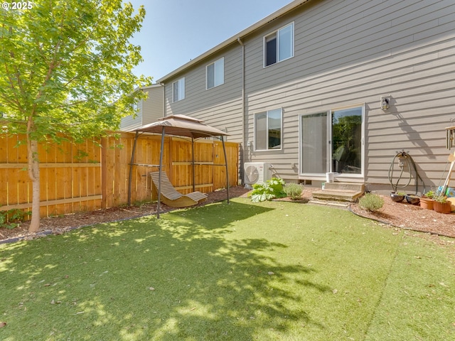 1939 NE 117th Ct, Vancouver, WA 98684 - rear view of house with a yard, ac unit, fence, a gazebo, and entry steps
