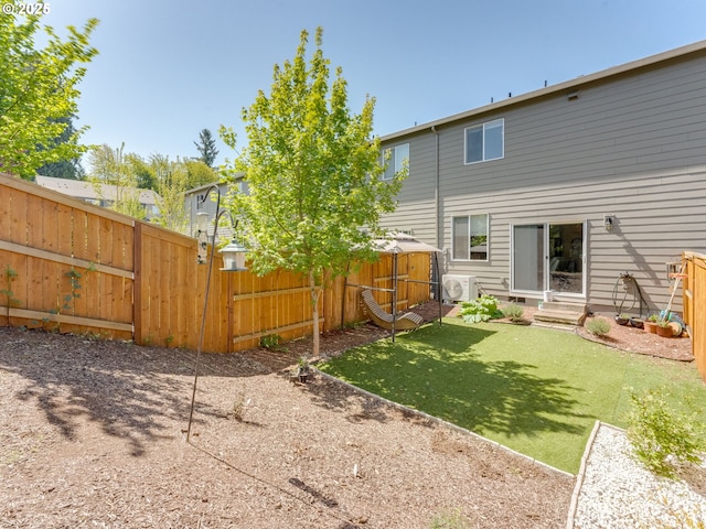 1939 NE 117th Ct, Vancouver, WA 98684 - back of property featuring a fenced backyard, an outdoor structure, ac unit, a storage unit, and entry steps