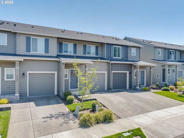 1939 NE 117th Ct, Vancouver, WA 98684 - townhome / multi-family property with driveway, board and batten siding, and an attached garage