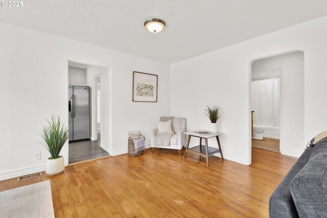 sitting room with light wood finished floors and baseboards