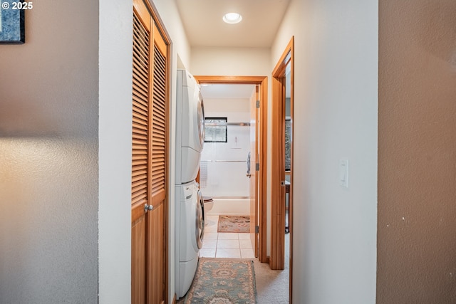 620 NW Naito Pkwy Unit B12, Portland, OR 97209 - hallway with stacked washer / dryer, recessed lighting, and light tile patterned floors