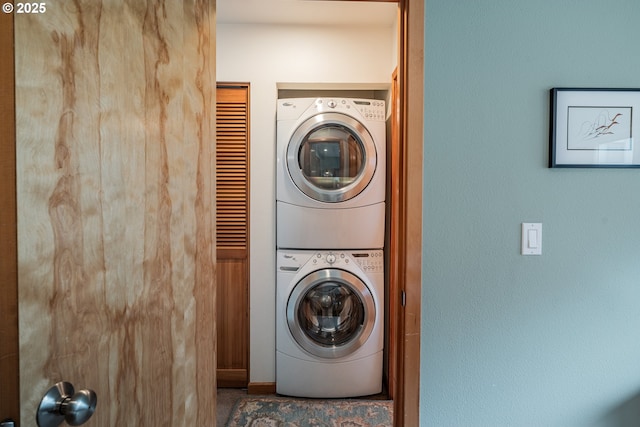 620 NW Naito Pkwy Unit B12, Portland, OR 97209 - laundry area featuring stacked washing maching and dryer and laundry area