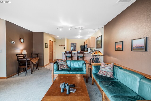 620 NW Naito Pkwy Unit B12, Portland, OR 97209 - living room with baseboards and light carpet