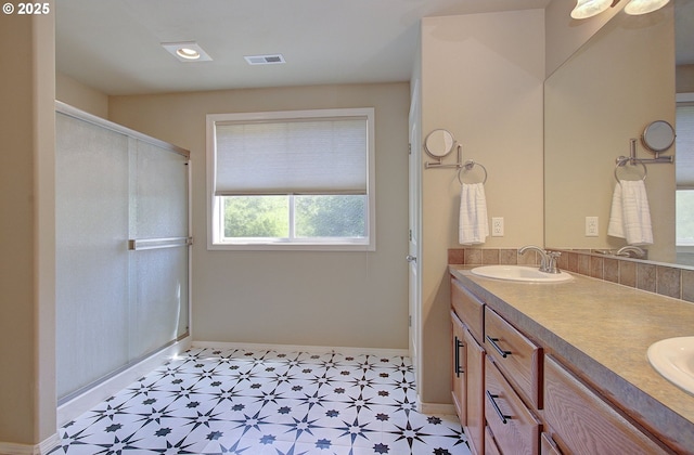 10201 NE 46th Ave, Vancouver, WA 98686 - bathroom with double vanity, tile patterned floors, a shower with shower door, baseboards, and recessed lighting