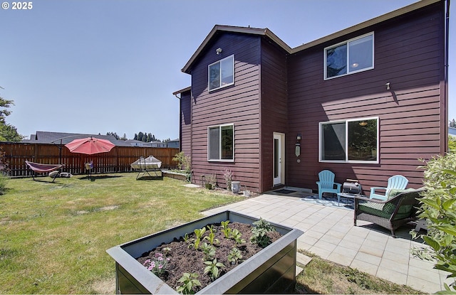 10201 NE 46th Ave, Vancouver, WA 98686 - back of house with a patio and a vegetable garden
