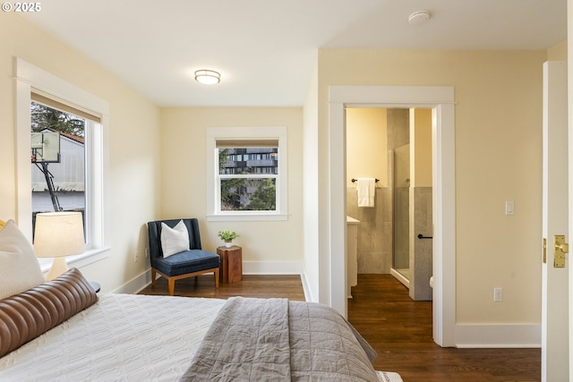 bedroom featuring dark wood-type flooring and baseboards