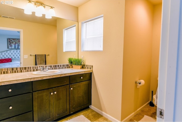 bathroom featuring ensuite bath, visible vents, toilet, and vanity