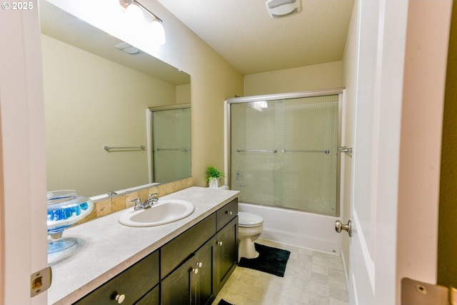 full bathroom featuring shower / bath combination with glass door, visible vents, toilet, and vanity