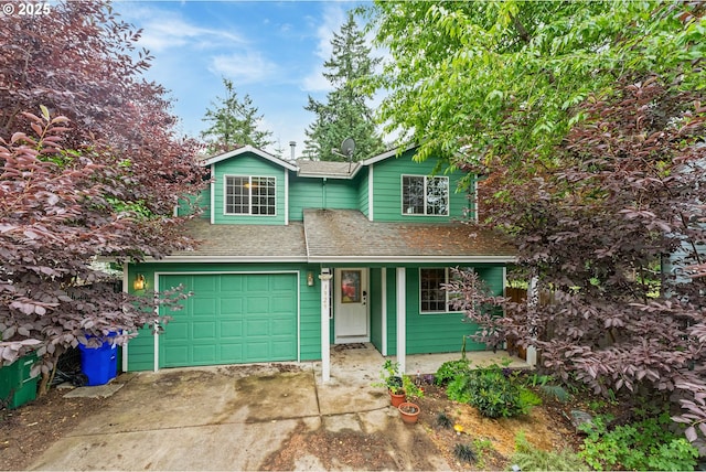 3929 SE 117th Pl, Portland, OR 97266 - traditional home featuring concrete driveway, a shingled roof, covered porch, and an attached garage
