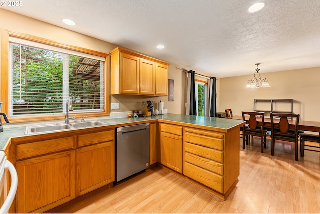 3929 SE 117th Pl, Portland, OR 97266 - kitchen featuring stainless steel dishwasher, a peninsula, light wood-style flooring, a chandelier, and plenty of natural light
