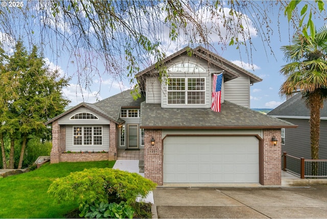 1350 4th St, Columbia City, OR 97018 - view of front of property featuring brick siding, concrete driveway, a garage, a front yard, and a shingled roof