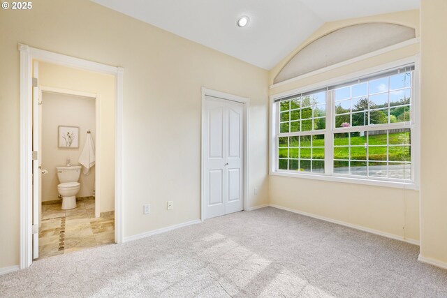 1350 4th St, Columbia City, OR 97018 - unfurnished bedroom featuring carpet, vaulted ceiling, baseboards, a closet, and ensuite bathroom
