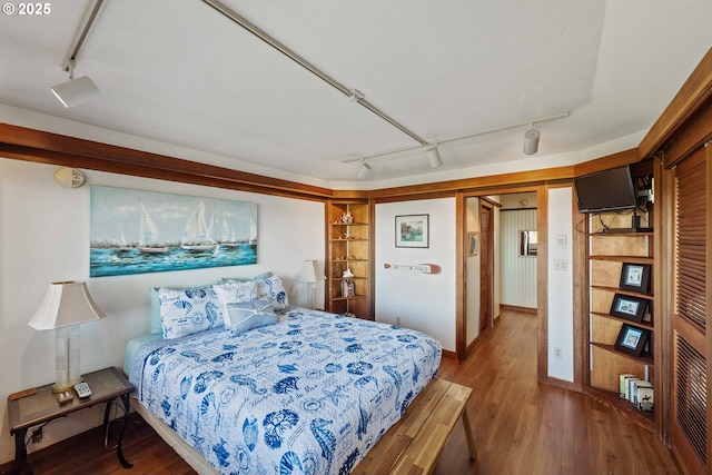 1230 Seagate Ave, Coos Bay, OR 97420 - bedroom with rail lighting and wood finished floors