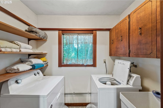 1230 Seagate Ave, Coos Bay, OR 97420 - washroom featuring washer and clothes dryer, cabinet space, and baseboards