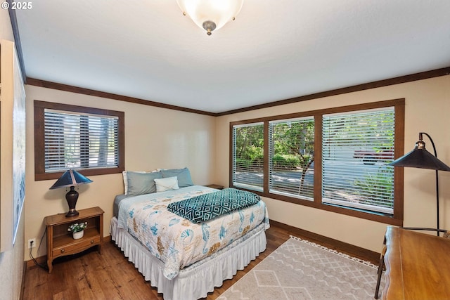 1230 Seagate Ave, Coos Bay, OR 97420 - bedroom featuring baseboards, wood finished floors, and crown molding