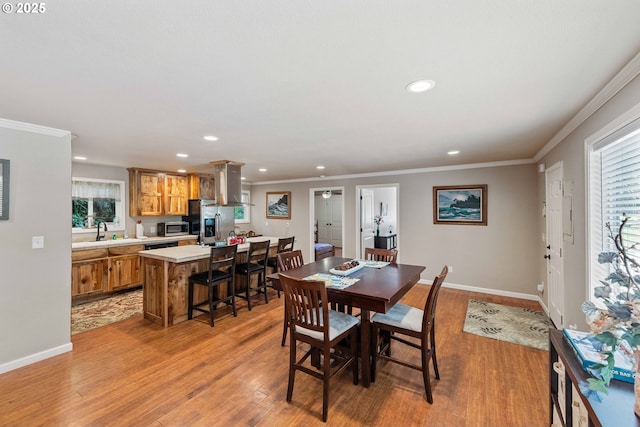 1230 Seagate Ave, Coos Bay, OR 97420 - dining space with recessed lighting, light wood finished floors, ornamental molding, and baseboards