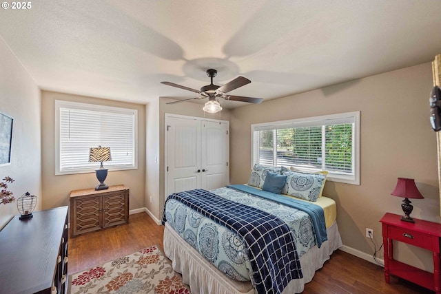 1230 Seagate Ave, Coos Bay, OR 97420 - bedroom with wood finished floors, baseboards, a closet, and ceiling fan